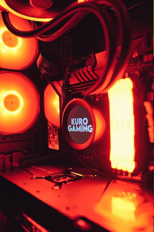 Inside a Kuro build: orange-lit fans and a Kuro-branded cooler